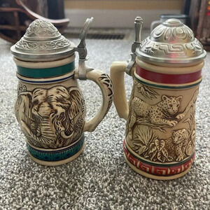 Lot of two Avon endangered species steins